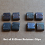 You receive a set of 8 glass retainer clips - enough for two glass panels on one side of your bi-fold doors.