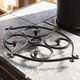 Minuteman Scroll Handforged Wrought Iron Trivet in Black installed